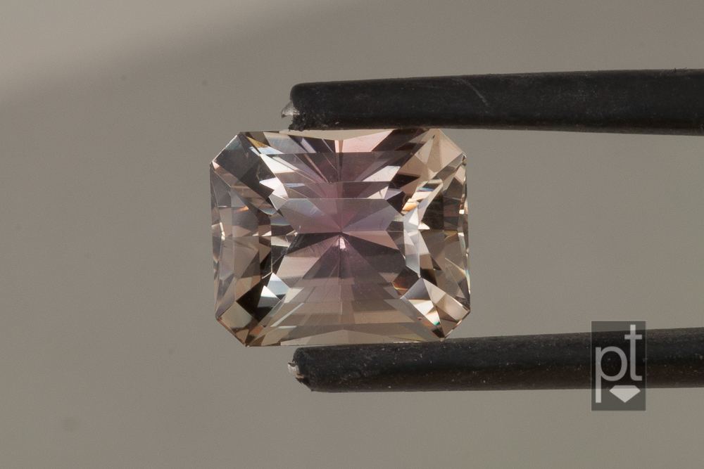 MT Yellow/Pink Sapphire in tweezers