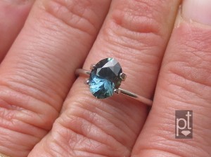 Blue-Green Sapphire in hand