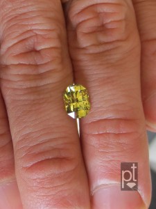 Natural Yellow Sapphire in hand