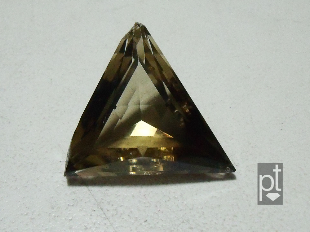 Damaged smokey quartz triangle