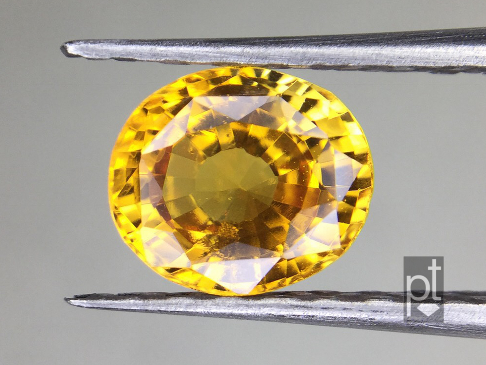 yellow sapphire oval, badly cut