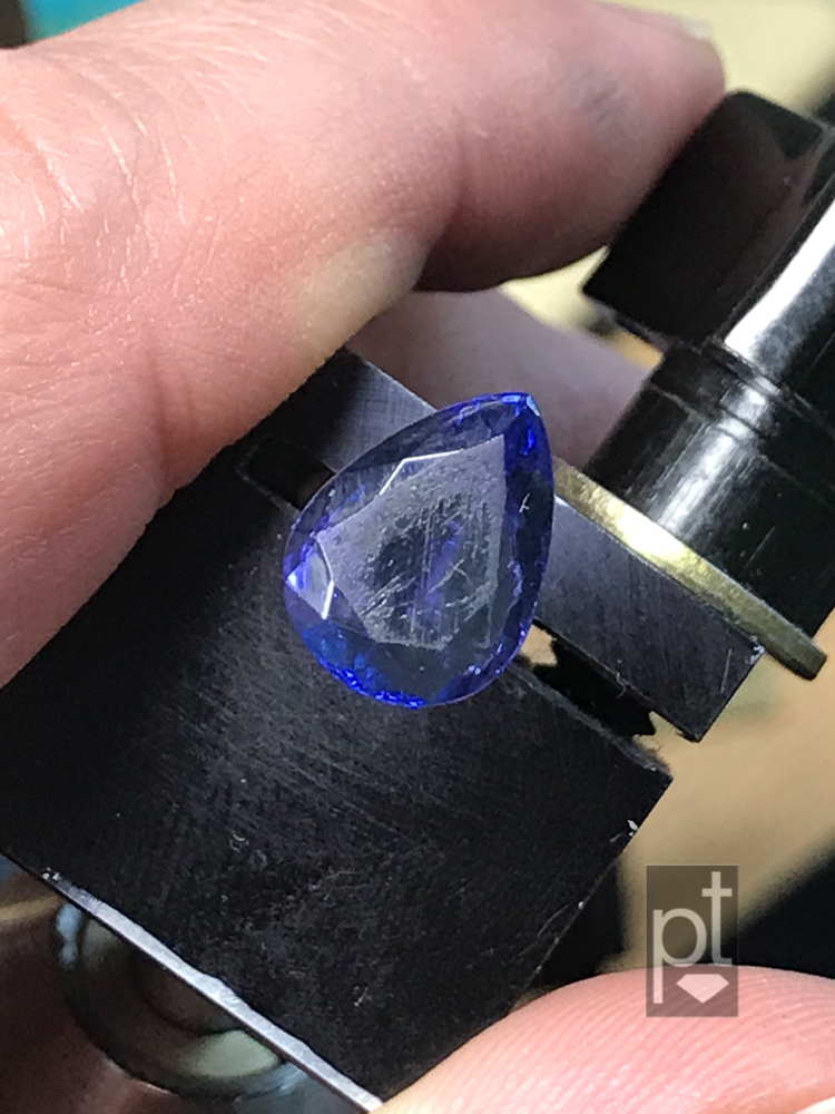 Tanzanite pear with scruffed up table, before repair